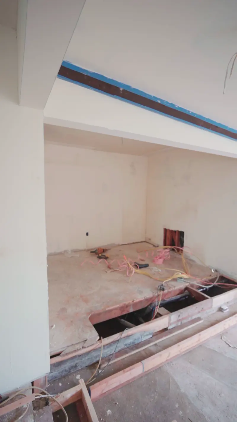 Floor opened for wiring and plumbing rough-in